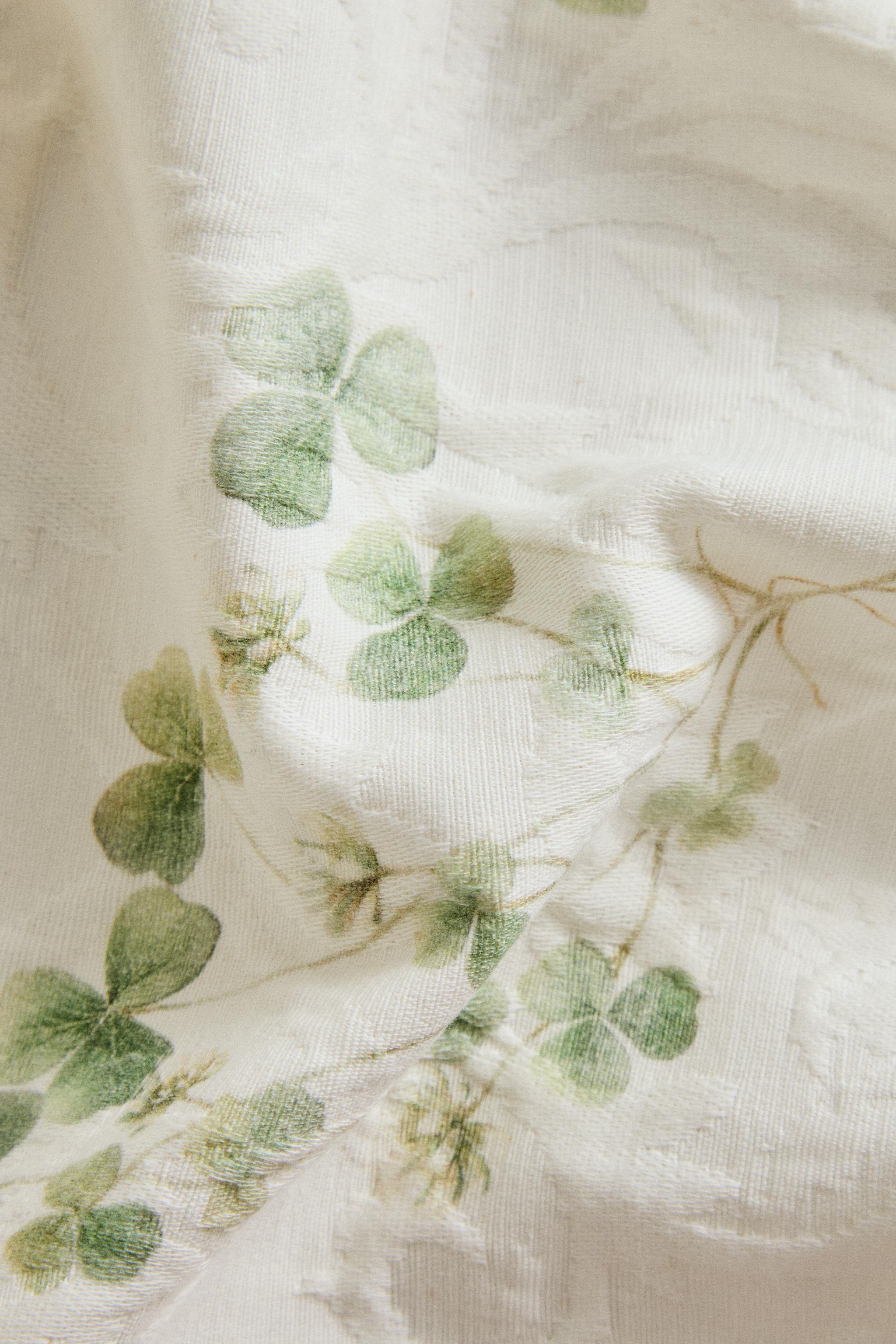NAPPE JACQUARD IMPRIMÉ TRÈFLE